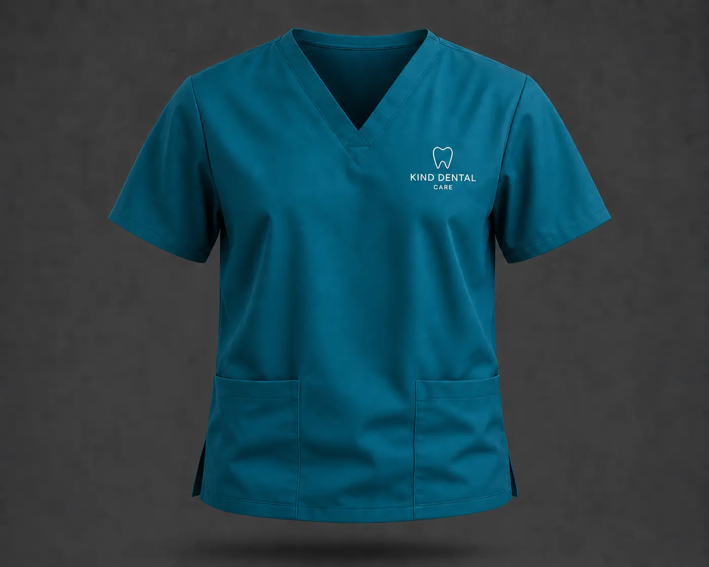 Teal Kind Dental Care branded scrub top